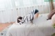 A woman laying on top of a bed in a bedroom.